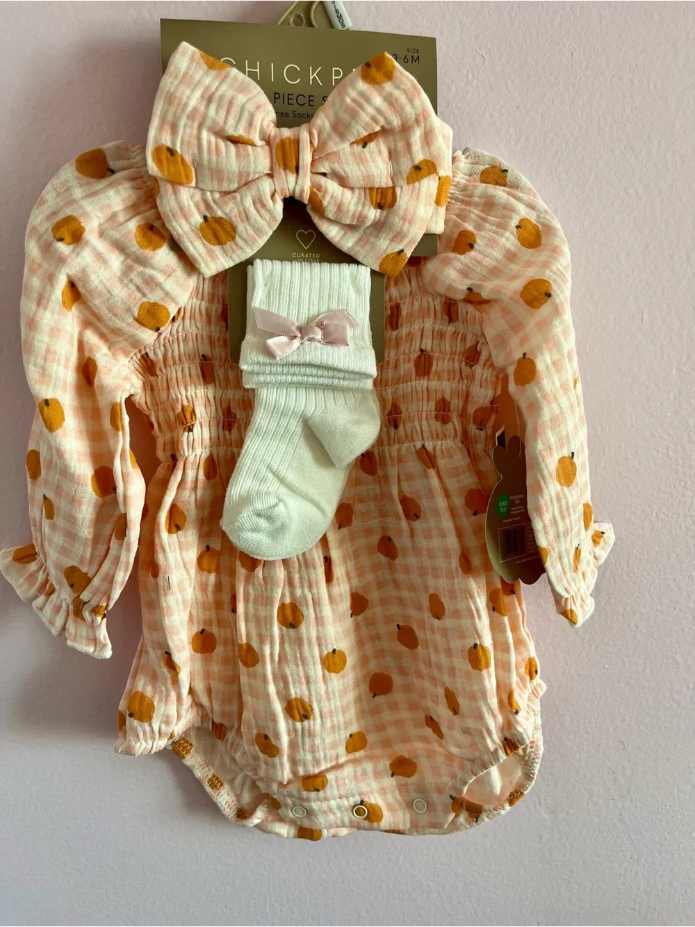 chick pea peach gingham romper set with cream socks and bow